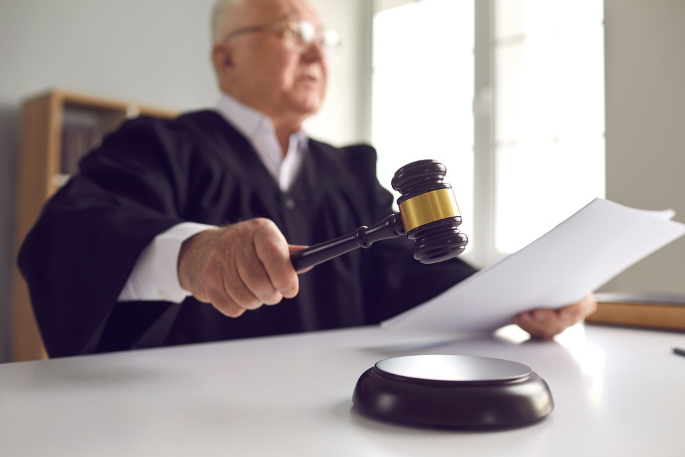 Judge holds a gavel as the court passes new drug crime law in Seattle.